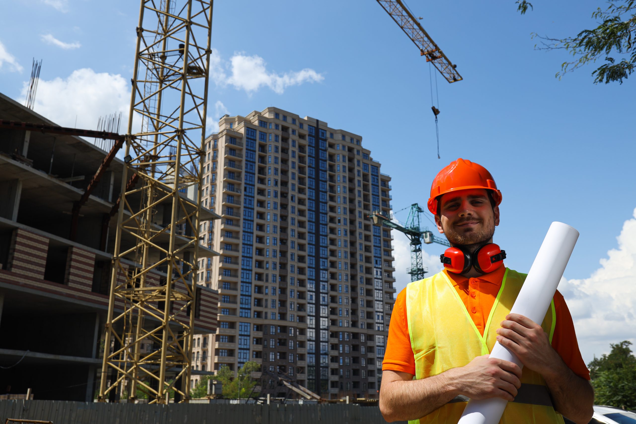 Young man civil engineer in safety hat